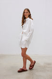  Classic white cotton shirt styled casually, showing versatile everyday wear