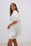  Classic white cotton shirt styled casually, showing versatile everyday wear