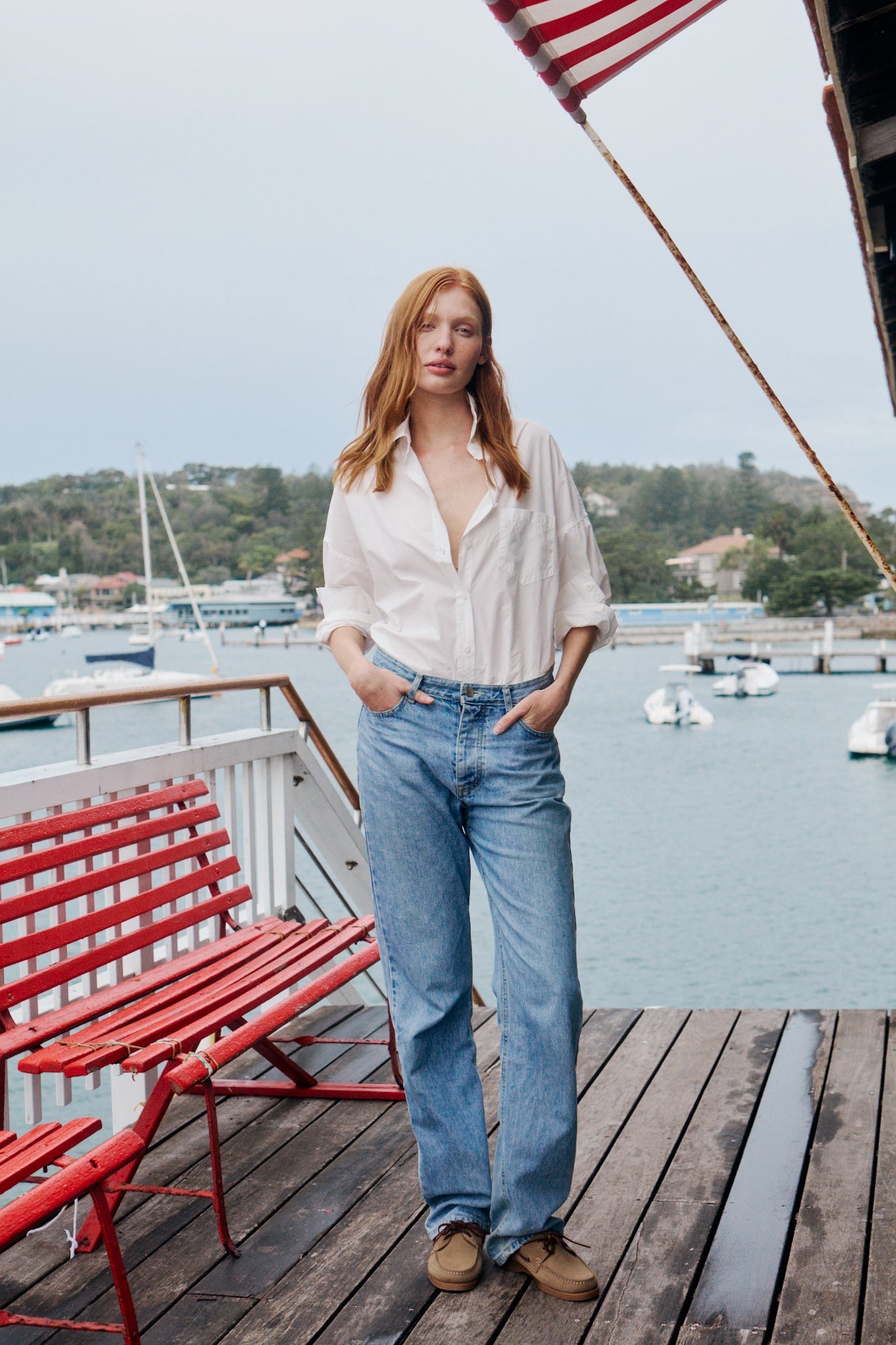 Woman wearing white cotton button-up shirt in relaxed casual style
