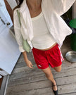  Classic white cotton shirt styled casually, showing versatile everyday wear